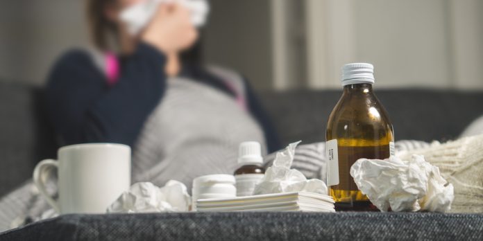 Sick,Woman,Sneezing,To,Tissue.,Medicine,,Hot,Beverage,And,Dirty