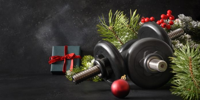 Christmas,Sport,Composition,With,Two,Sports,Dumbbells,,Gift,,Evergreen,Branches